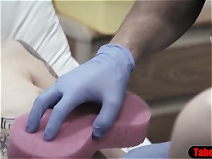 medic gives patient a sponge bath and vaginal examine